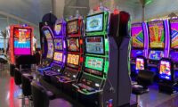 empty chairs in front of arcade machines