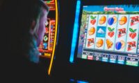 man playing slot machine game