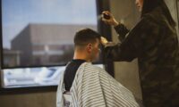 woman praying gel mans hair